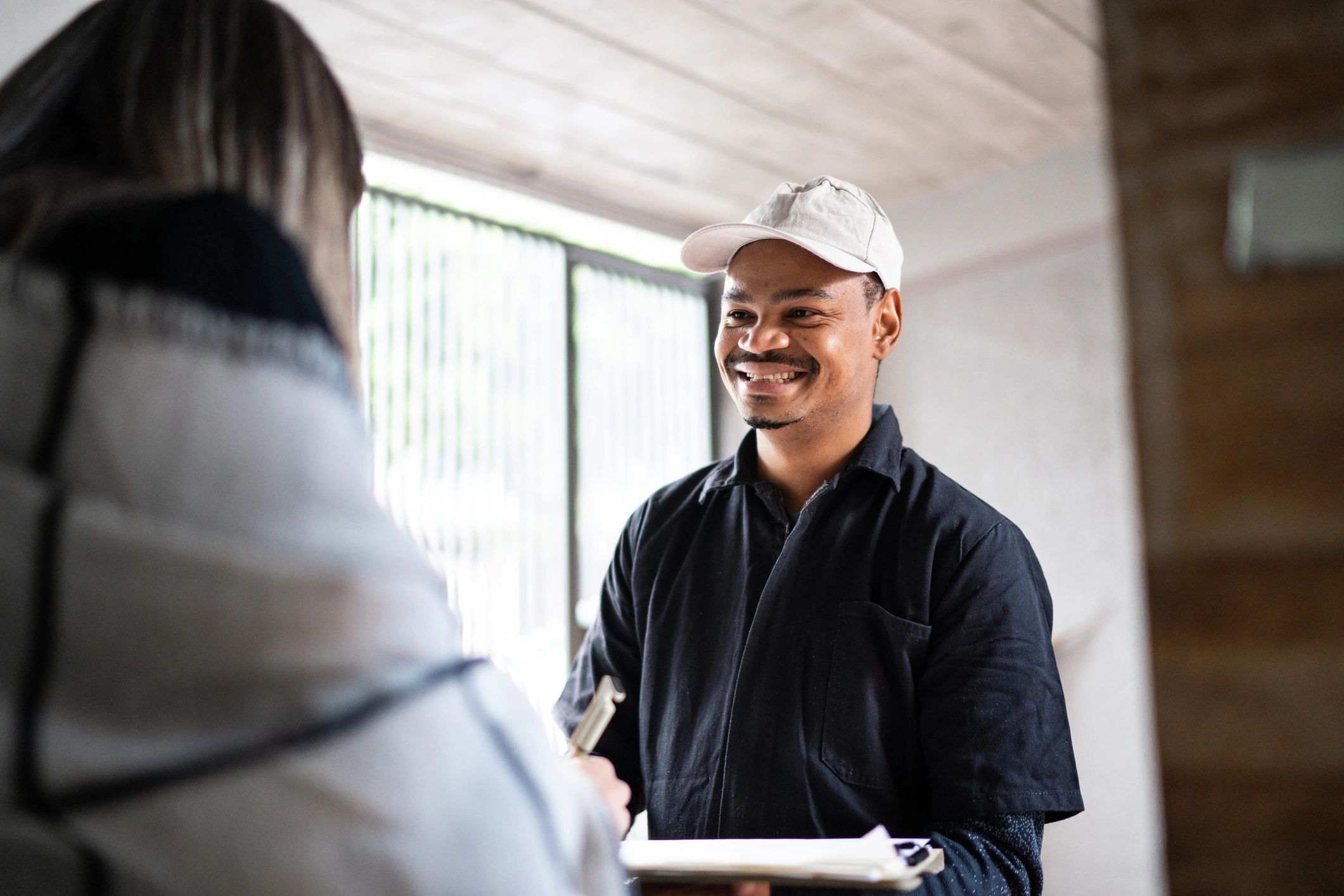 Service professional reviewing paperwork with a customer
