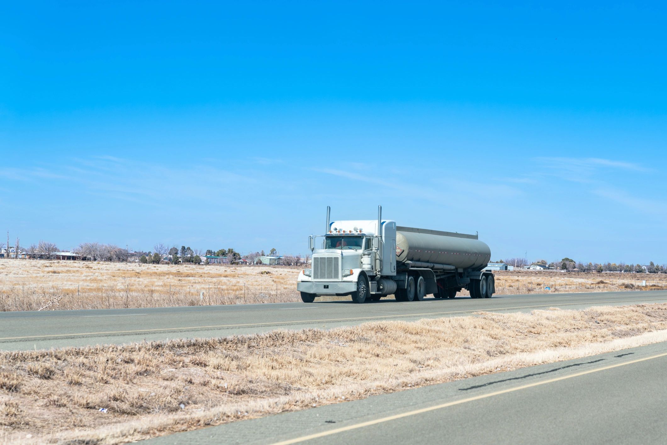 Tanker truck traveling through a local service region